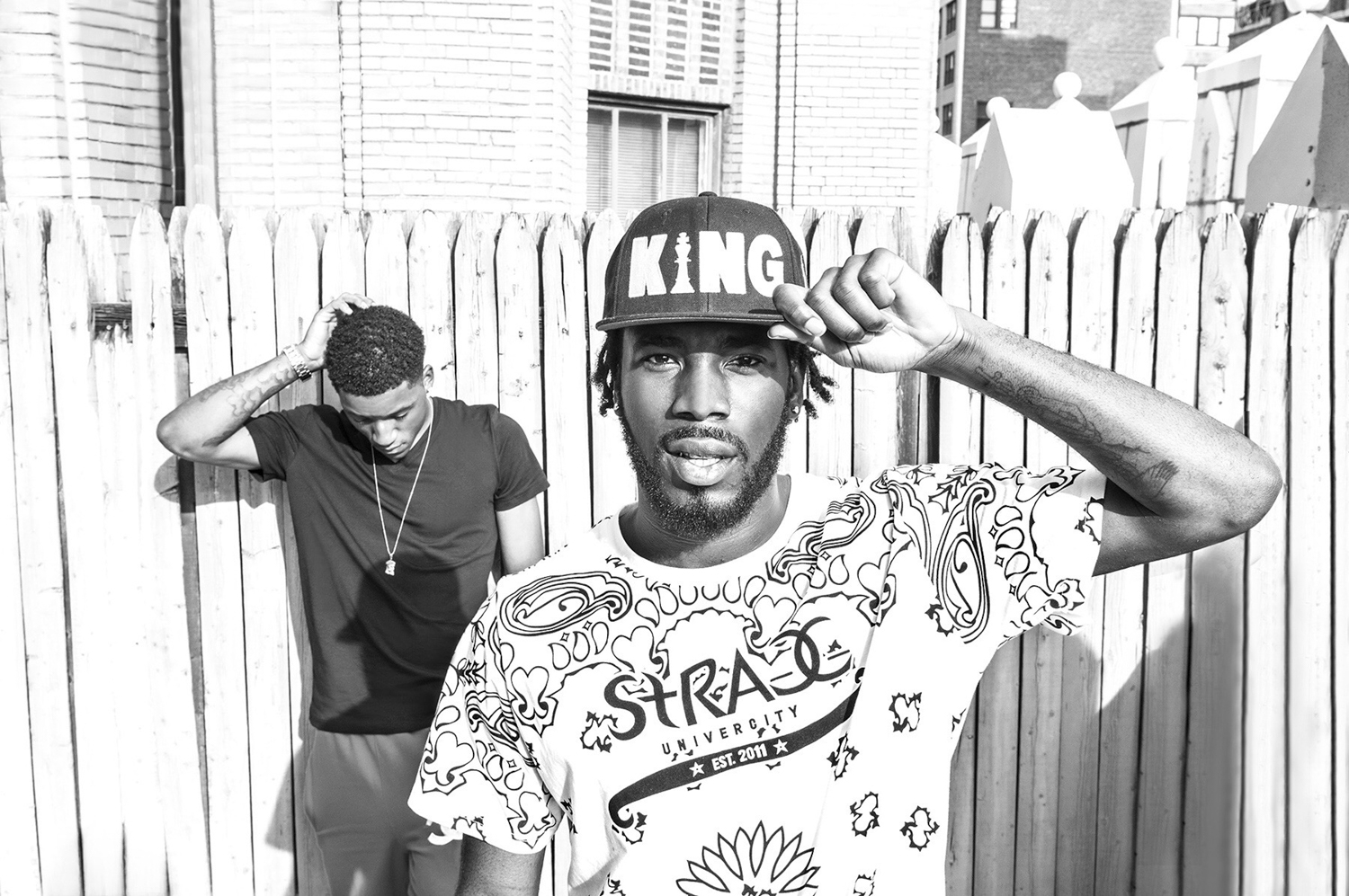 Dougie F and DJ Fire black and white holding baseball hat by Aviva Klein